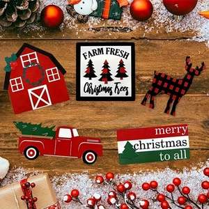 Flat lay of farmhouse Christmas tiered tray decor with wooden signs and pine cones