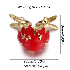 Detail view of red enamel rabbit egg charm in gold copper showing product dimensions