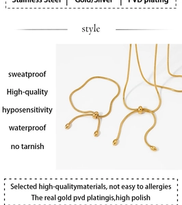 Detail of PVD gold plated stainless steel snake chain set with adjustable sliding clasp