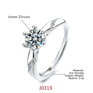 Macro detail of six-prong set 6mm cubic zirconia on adjustable copper ring