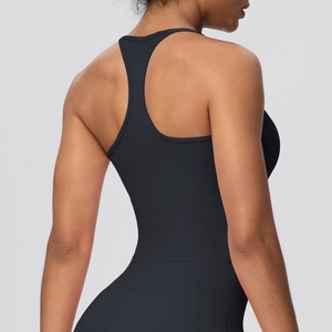 Detail of black racerback yoga tank top showing elastic quick-dry fabric and athletic fit