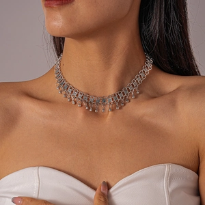 Detailed view of a silver double-layered choker featuring metal beads and a padlock charm