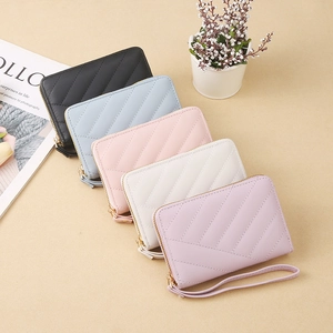 Collection of V-quilted long wallets in various pastel colors with wristlet straps
