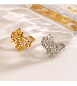 Detail of adjustable gold and silver leaf rings with elegant water ripple shadows