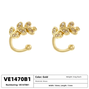 Detail showing gold plated brass leaf ear cuffs with tiny white cubic zirconia stones