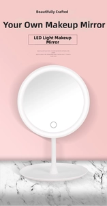 Detail of white desktop LED makeup mirror with touch sensor and storage base