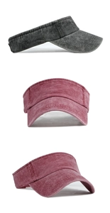 Close-up of washed cotton sun visors in grey and red showing stitching details
