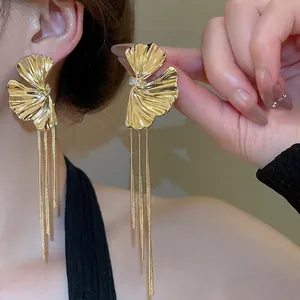 Elegant gold ginkgo leaf tassel earrings with rhinestones and long metallic chains