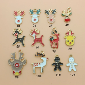 Set of 12 Christmas alloy charms featuring elk and gingerbread man shapes with gold edges