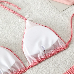 Detail of red gingham bikini top with breathable mesh lining and removable pads