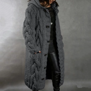 Side view of long grey cable-knit hooded cardigan with buttons and deep pockets