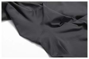 Detailed view of high-elasticity dark grey yoga fabric with professional flatlock stitching