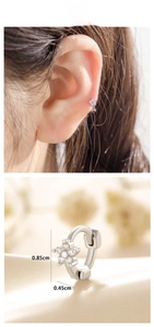 Detailed view of zircon flower ear cuffs showing precise 0.85cm by 0.45cm dimensions