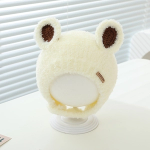 Detailed view of plush baby winter hat with cute bear ears and fashion label tag