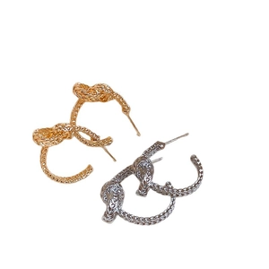 Knotted twisted C-shape hoop earrings in gold and silver finish for women