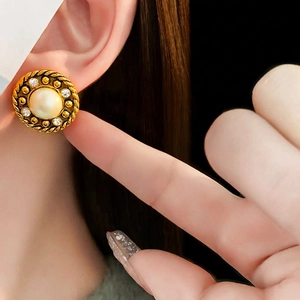 Vintage style gold earrings with large pearl and sparkling rhinestone crystals