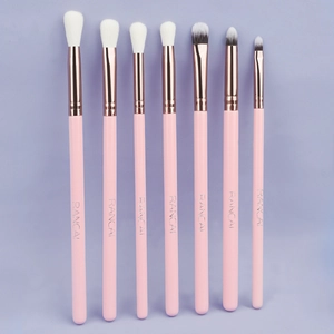 Professional 7-piece pink eye makeup brush set with rose gold metal tubes and soft fibers