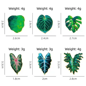 Tropical leaf enamel pin set featuring six diverse botanical plant leaf designs