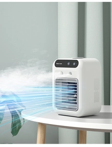 Close-up of a white mini air cooler featuring a spray humidification vent and top control panel