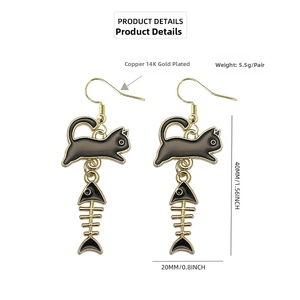 Detailed view of 14K gold plated cat and fish bone drop earrings with dimensions