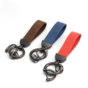 Suede leather car keychains in brown, blue, and red with durable dark metal rings