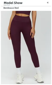 Detail of wine red high-waisted yoga leggings showing seamless knit and tummy control texture
