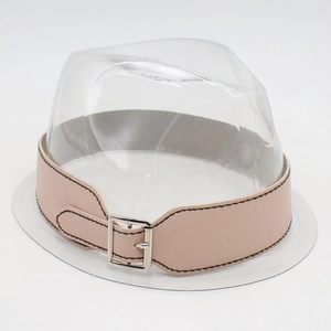 Detail of pink leather hat band with silver metal buckle and black stitching details
