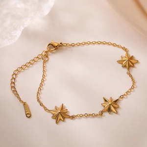 18K gold plated stainless steel necklace featuring three North Star starburst pendants