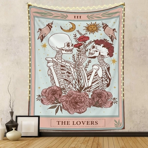Detail of The Lovers tarot tapestry with LED lights in a cozy boho room decor setting