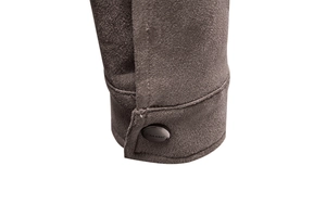Detail of suede jacket cuff with dark metal button featuring CLASSIC engraving
