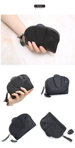 Detail view of black pebble leather elephant coin purse with golden zipper and tassel