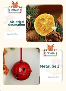 Detailed shot of Christmas wreath elements with dried orange slices and red metal bells