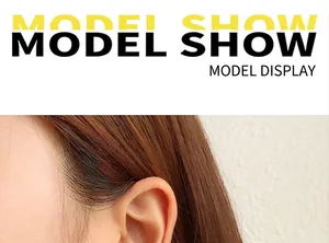 Close-up of a minimalist C-shaped earring in 18K gold plating worn by a model