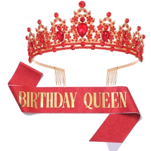Detail of red glitter sash with gold Birthday Queen text and red rhinestone tiara