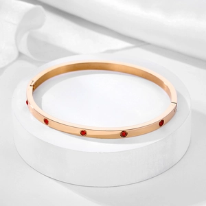 Elegantly crafted 18k rose gold plated stainless steel bangle set with red zircons
