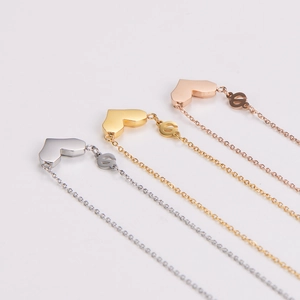 Three-color geometric heart pendant necklaces in silver, gold, and rose gold finishes