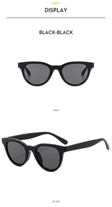 Front and side view of classic black cat-eye sunglasses for women with a sleek finish