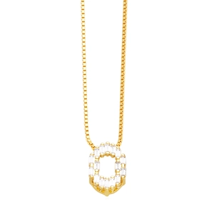 Macro detail of gold letter O pendant necklace with sparkling zircon channel setting