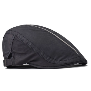 Detail of adjustable metal buckle and grey striped stitching on black cotton flat cap