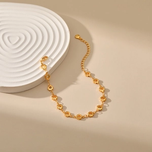 18K gold plated brass bracelet featuring hollow flower links and adjustable chain clasp