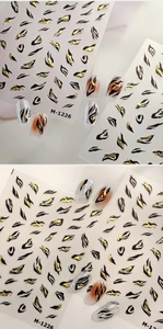 Detail of M-1226 nail stickers with 3D black and gold tiger patterns and metallic foil finish
