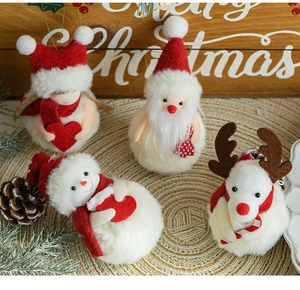 Cosy Christmas plush snowman and reindeer hanging ornaments on a rustic wooden table setup