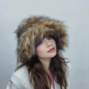 Close-up of thick faux raccoon fur texture on a warm winter hat in brown and grey