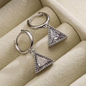 Minimalist silver triangle pendant earrings with zircon in a beige velvet jewelry box