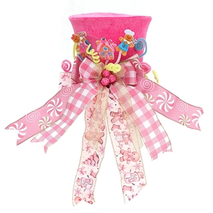 Pink Christmas tree topper hat featuring gingerbread men decorations and colorful ribbons