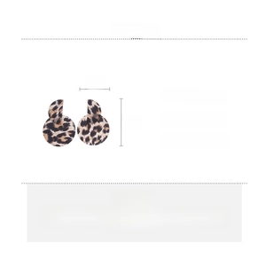 Detail view of round acrylic earrings with leopard print, showing 6cm by 4cm dimensions