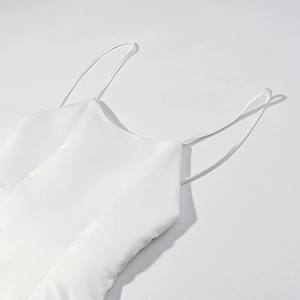 Elegant white satin sleeveless mini dress with feather trim and open back design