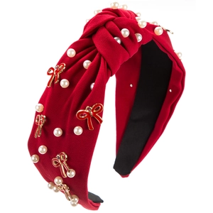 Red knotted fabric headband with white pearls and red butterfly enamel pendant