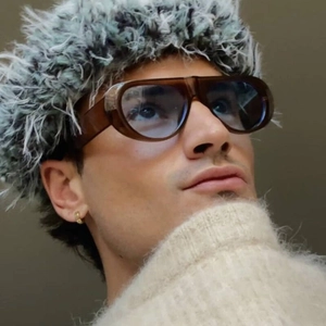 Close-up of retro oversized thick frame sunglasses with blue lenses for winter fashion