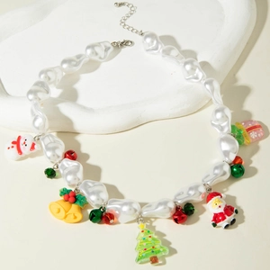 Detailed macro view of Christmas necklace with snowman pendants and baroque faux pearls